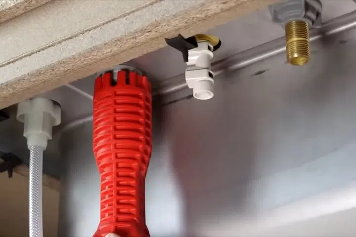 Close-up of a plumbing repair tool or fitting being used on pipe or fixture work for Contact Goodyear Plumbing Pros