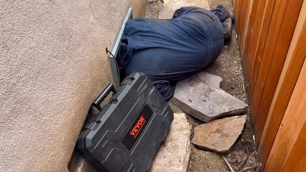Opened slab area and leak detection equipment used to locate a hidden pipe leak for 7 Signs Your Goodyear Home Has a Slab Leak (And What to Do Before