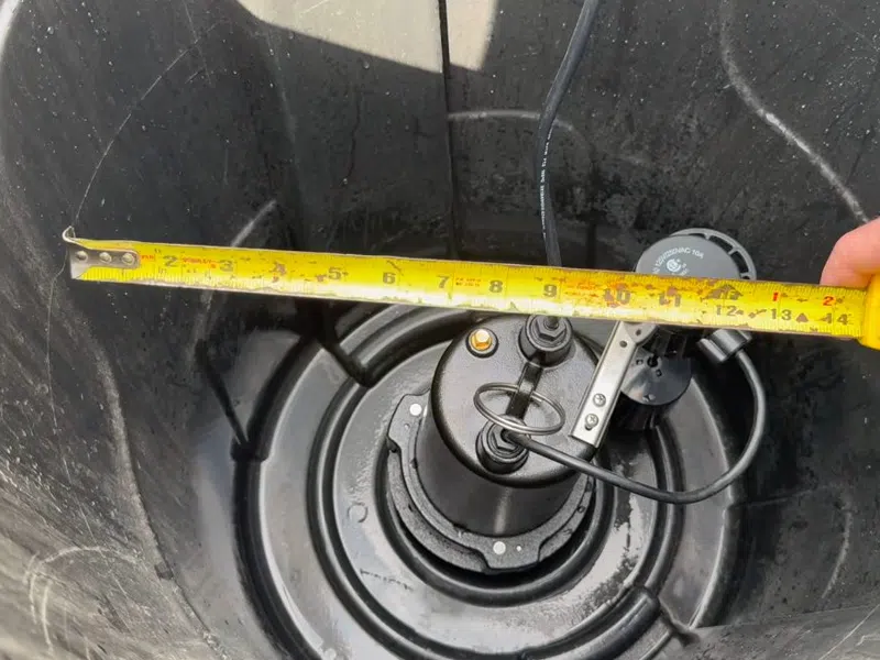 Sump pump basin and discharge piping during installation or service for How to Read Your Goodyear Water Bill and Spot a Hidden Leak showing sump pump basin discharge piping installation read water bill spot hidden detail