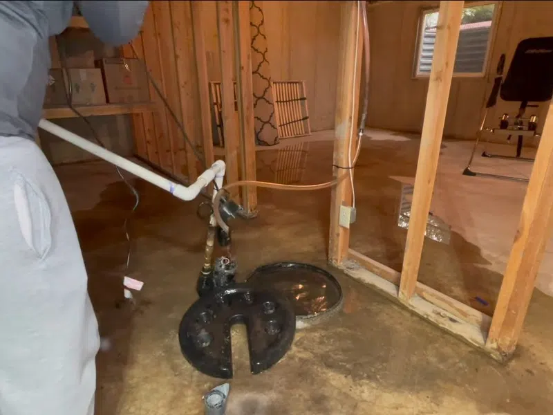 Sump pump basin and discharge piping during installation or service for How to Read Your Goodyear Water Bill and Spot a Hidden Leak