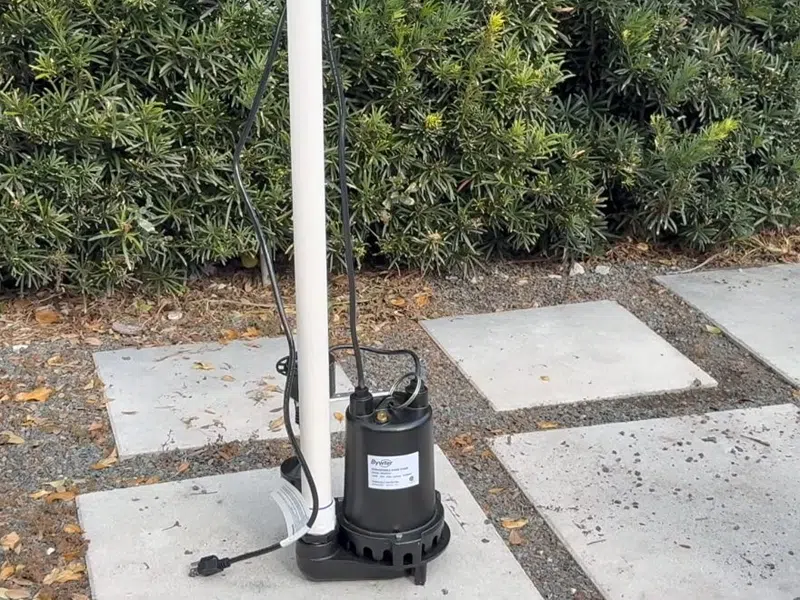 Sump pump basin and discharge piping during installation or service for 7 Signs Your Goodyear Home Has a Slab Leak (And What to Do Before