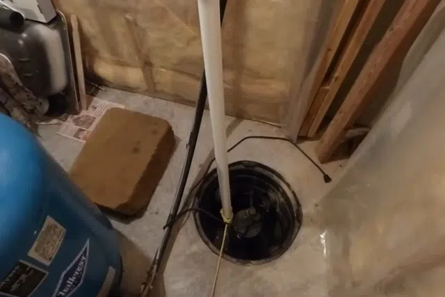 Sump pump basin and discharge piping during installation or service for Plumbing Tips & Guides for West Valley Homeowners