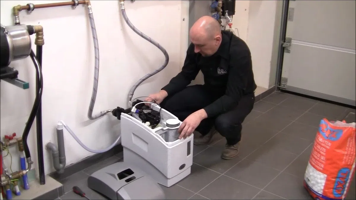Whole-home water softener with control valve, brine tank, and plumbing connections for About Goodyear Plumbing Pros