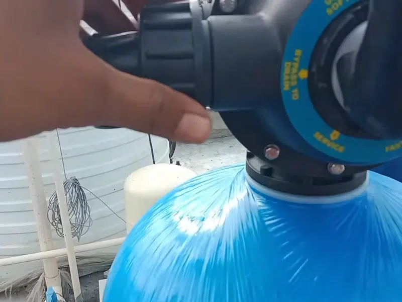 Whole-home water softener with control valve, brine tank, and plumbing connections for How Long Do Copper Pipes Last in Goodyear’s Hard Water? (And When to Stop showing whole water softener control valve brine tank connections copper pipe lifespan closeup