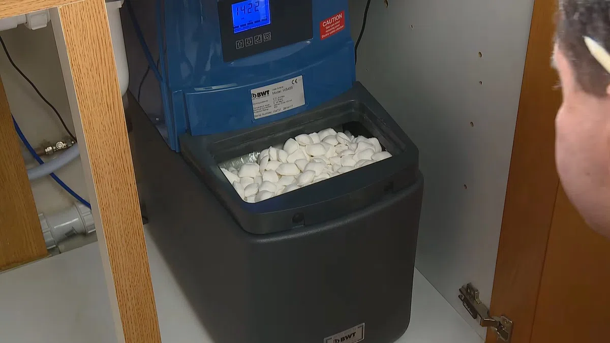 Whole-home water softener with control valve, brine tank, and plumbing connections for How Long Do Copper Pipes Last in Goodyear’s Hard Water? (And When to Stop
