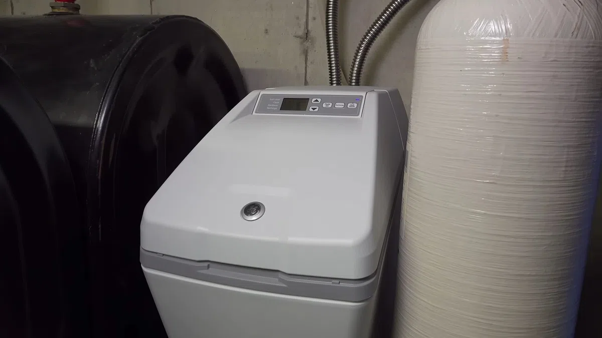 Whole-home water softener with control valve, brine tank, and plumbing connections for Why Goodyear Water Is So Hard — and What It’s Doing to Your Plumbing