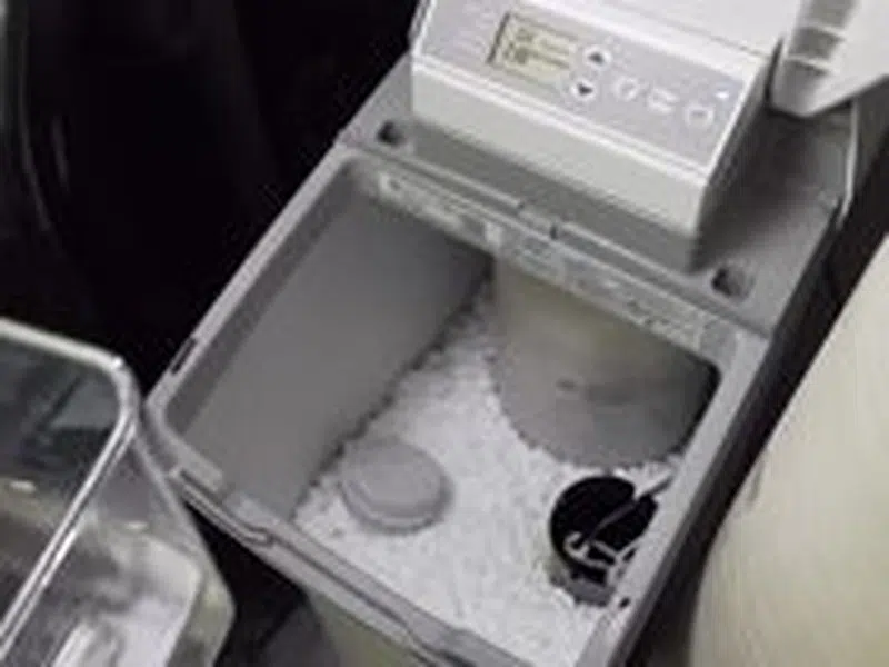 Whole-home water softener with control valve, brine tank, and plumbing connections for Verrado Homeowner’s Guide to Hard Water Plumbing in Buckeye,
